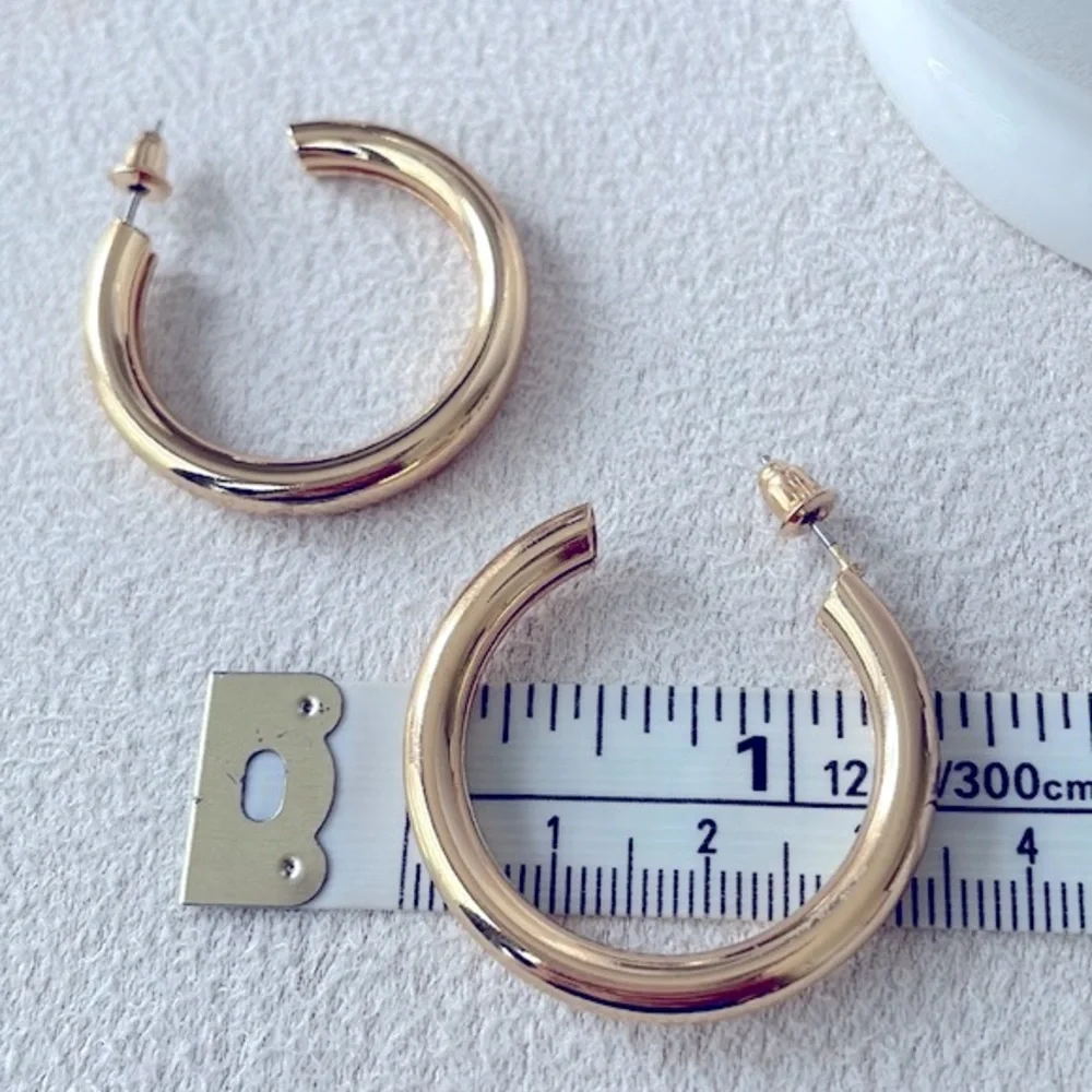Thick gold hoop earrings